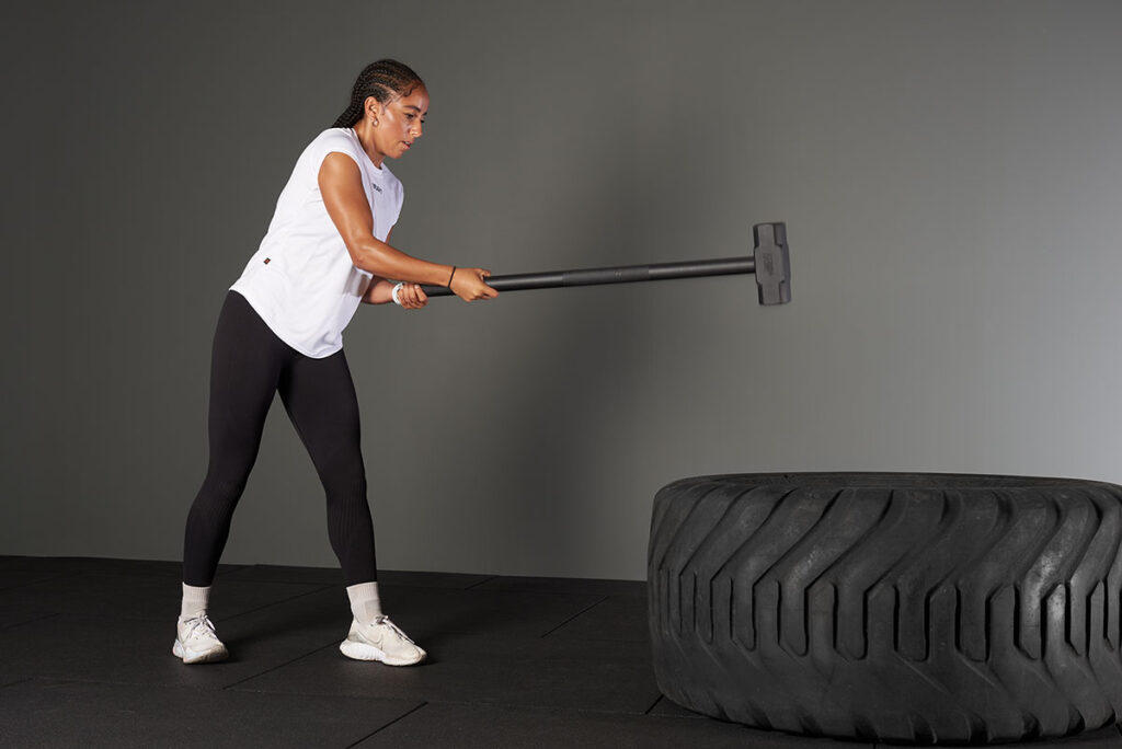 Staggered Hammer Tyre Slam with a Mirafit Gym Workout Hammer