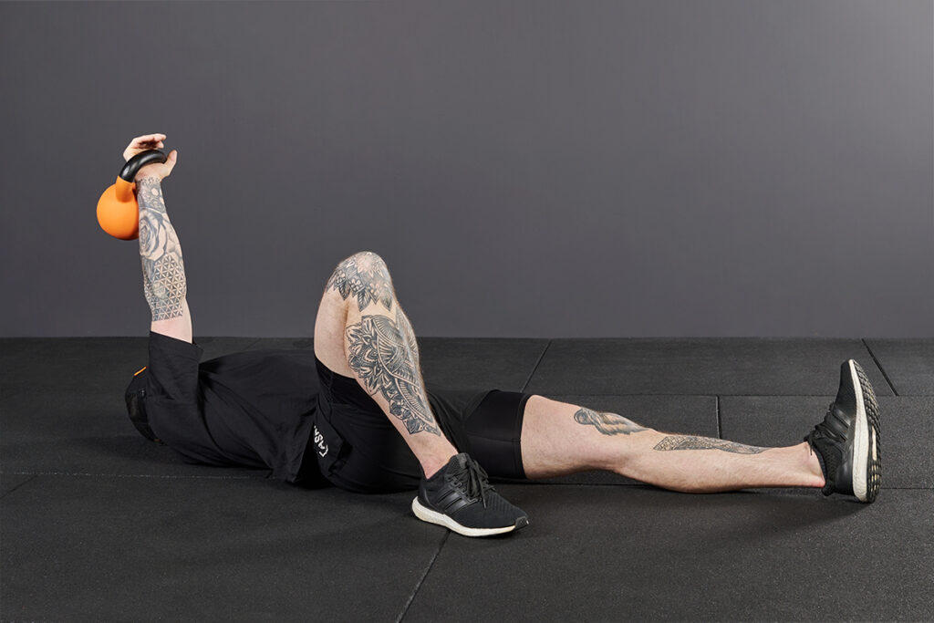Roll to Press Mirafit Kettlebell Turkish Get Up Step 1 - Roll to Press