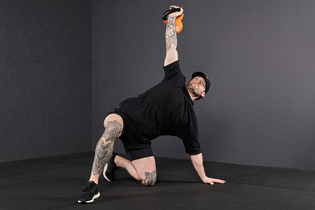 Leg Sweep to Knee Mirafit Kettlebell Turkish Get Up Step 5 - Leg Sweep to Knee