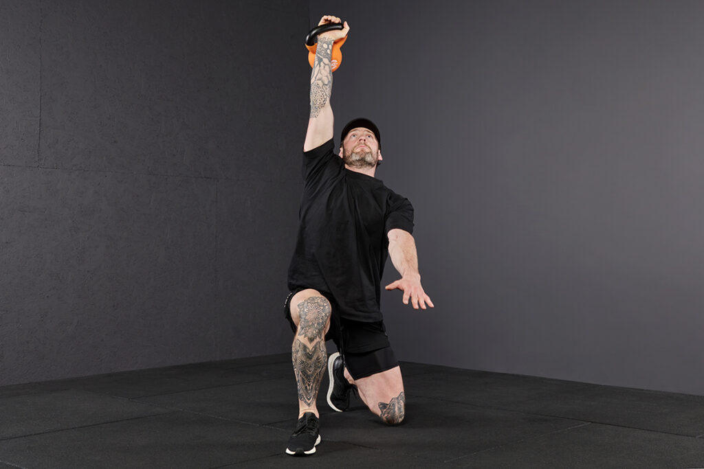 Knee Support to Half Kneeling Mirafit Kettlebell Turkish Get Up Step 6 - Knee Support to Half Kneeling