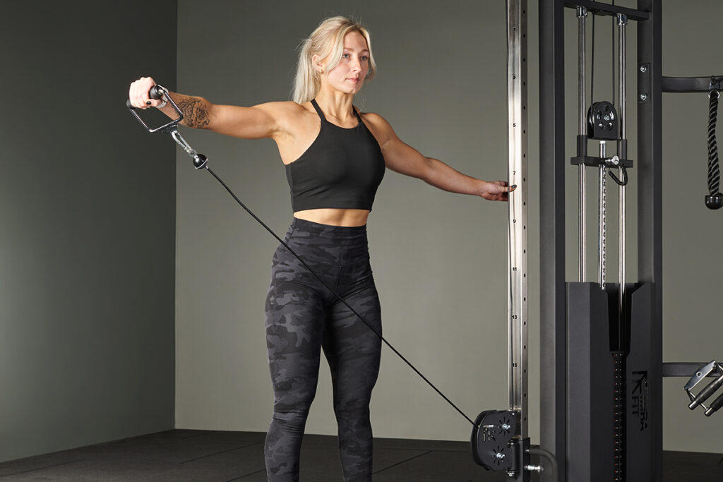 Single Arm Lateral Raise Single Arm Lateral Raise in a Mirafit Functional Trainer