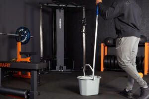 Man cleaning his Mirafit Home Gym