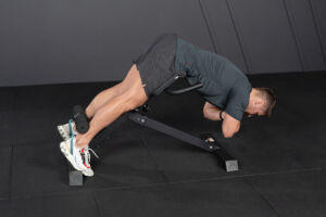Man using a Mirafit Hyperextension Bench