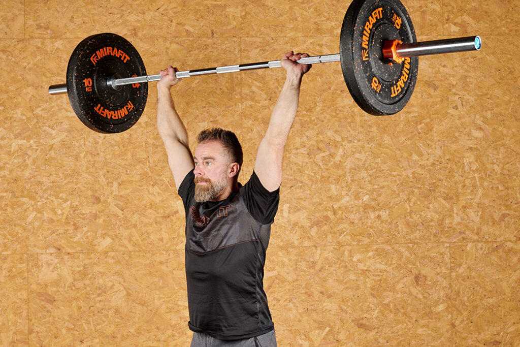 Mirafit Crumb Rubber Olympic Bumper Plates Shoulder Press using Mirafit Crumb Rubber Olympic Bumper Plates