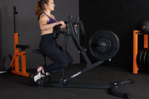 Woman using a Mirafit Seated Row Machine