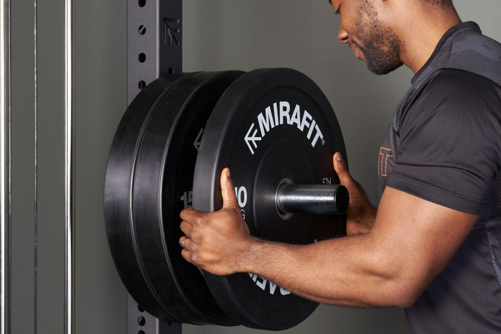 Mirafit M4 Weight Storage Poles Man using Mirafit M4 Weight Storage Poles