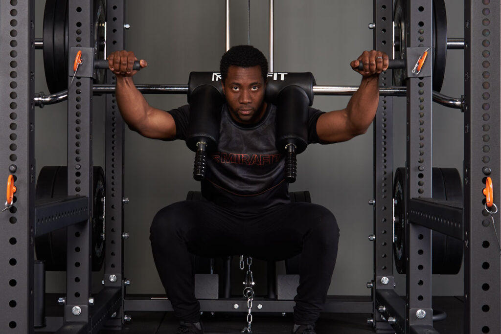 Mirafit M4 Squat Handles Man using Mirafit M4 Squat Handles