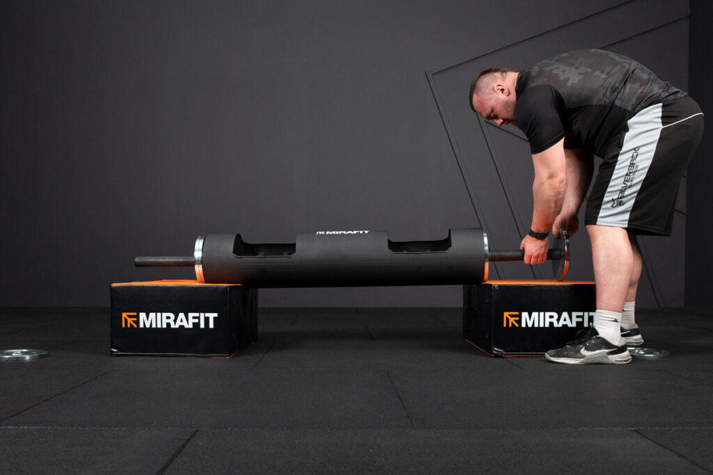 Adam Bishop with Mirafit Strongman Log