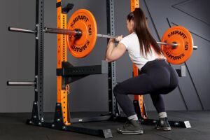 Woman Squatting with Mirafit Orange Weight Plates