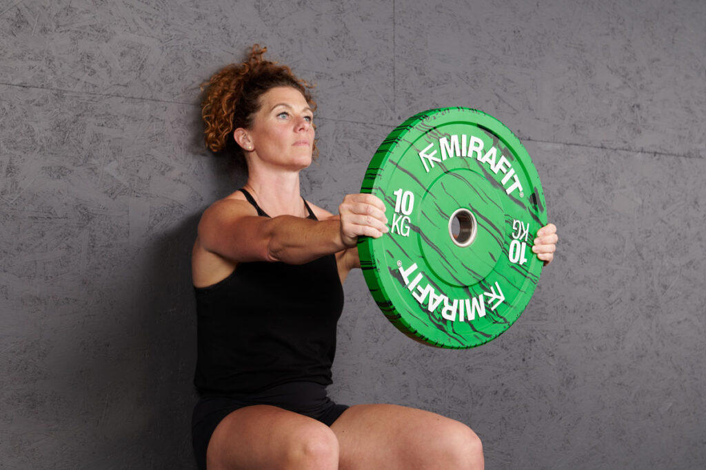 Wall Sit with Forward Plate Hold using Mirafit Marbled Bumper Plate