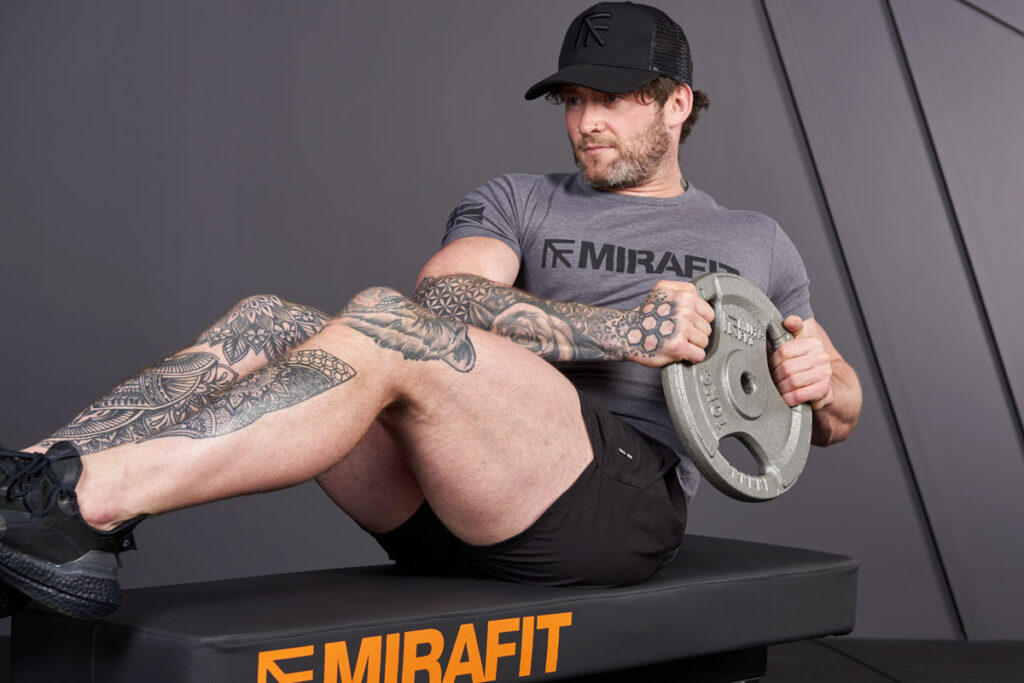Russian Twist Russian Twist with Mirafit Tri-Grip Weight Plate for a lower ab workout