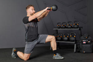 Half kneeling swing with a Mirafit Cast Iron Kettlebell
