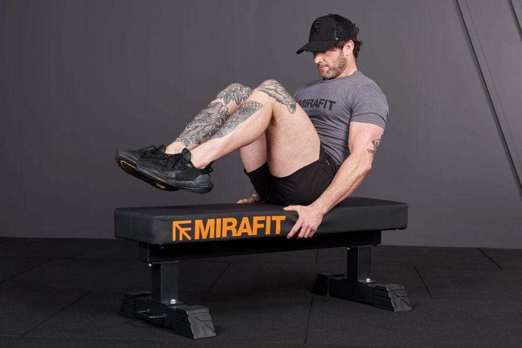 Knee to Chest Crunches Knee to chest crunches with Mirafit M3 Flat Weight Bench - Lower ab workout