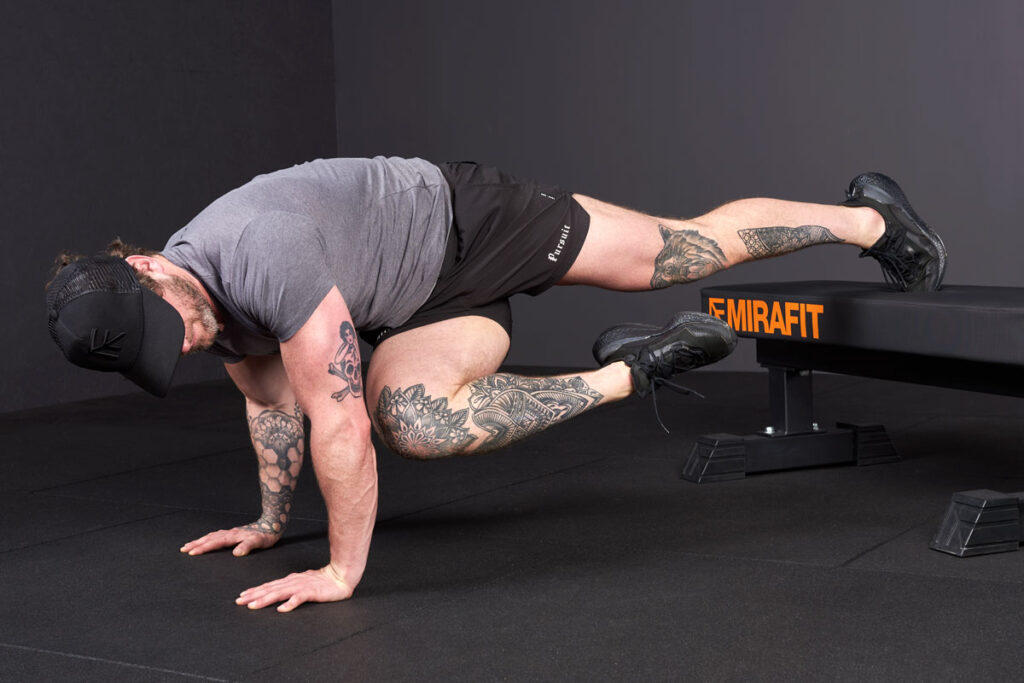 Knee to Elbows Knee to elbow on Mirafit M3 Flat Weight Bench for a lower ab workout