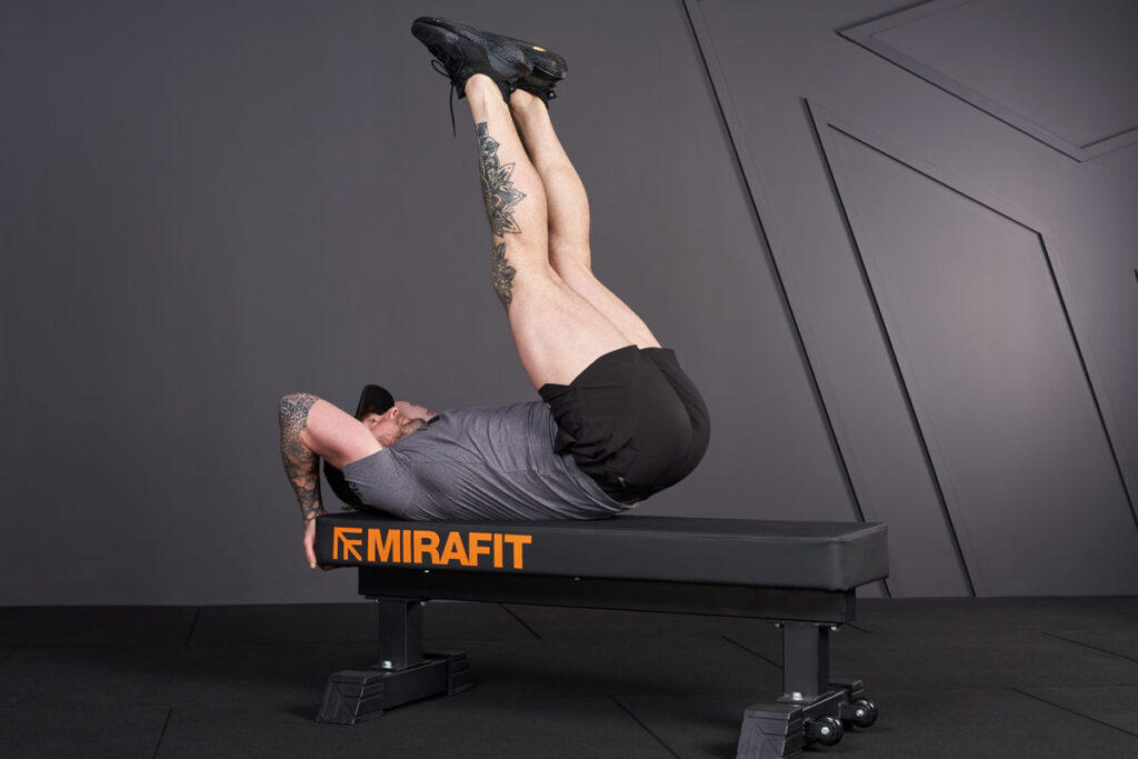 Leg Raises Leg raise on Mirafit M3 Flat Weight Bench for a lower ab workout