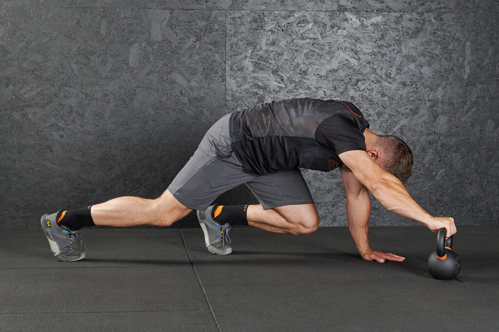 Kettlebell Bear Crawl Mirafit Cast Iron Kettlebell Bear Crawl, this is a functional kettlebell exercise