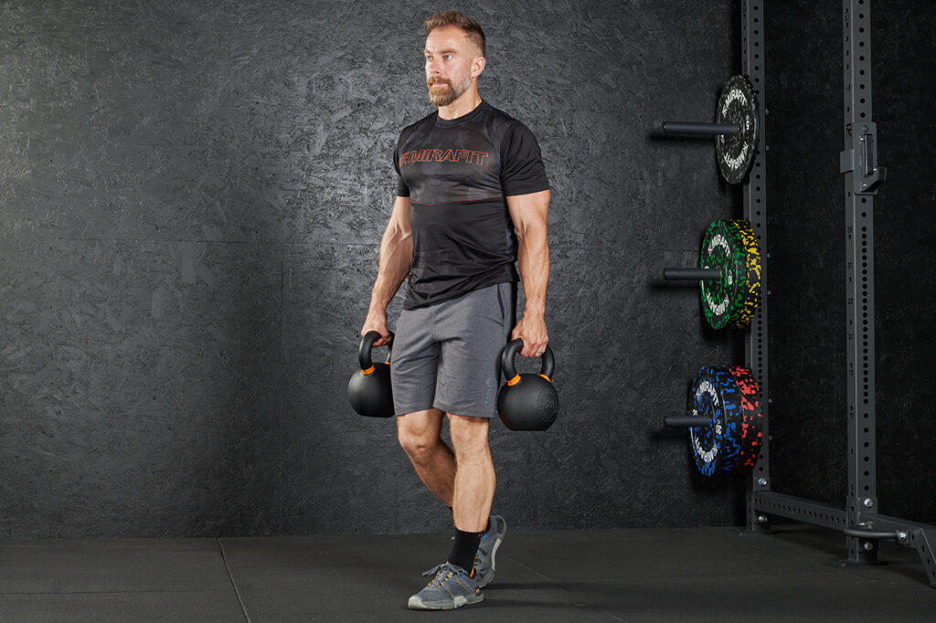 Kettlebell Farmers Walk Farmers Walk (a functional kettlebell exercise) with a Mirafit Cast Iron Kettlebell