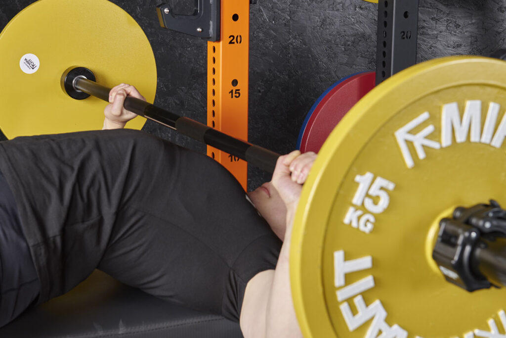 Bobbie Butters Spoto bench press close up with Mirafit Weight Plates