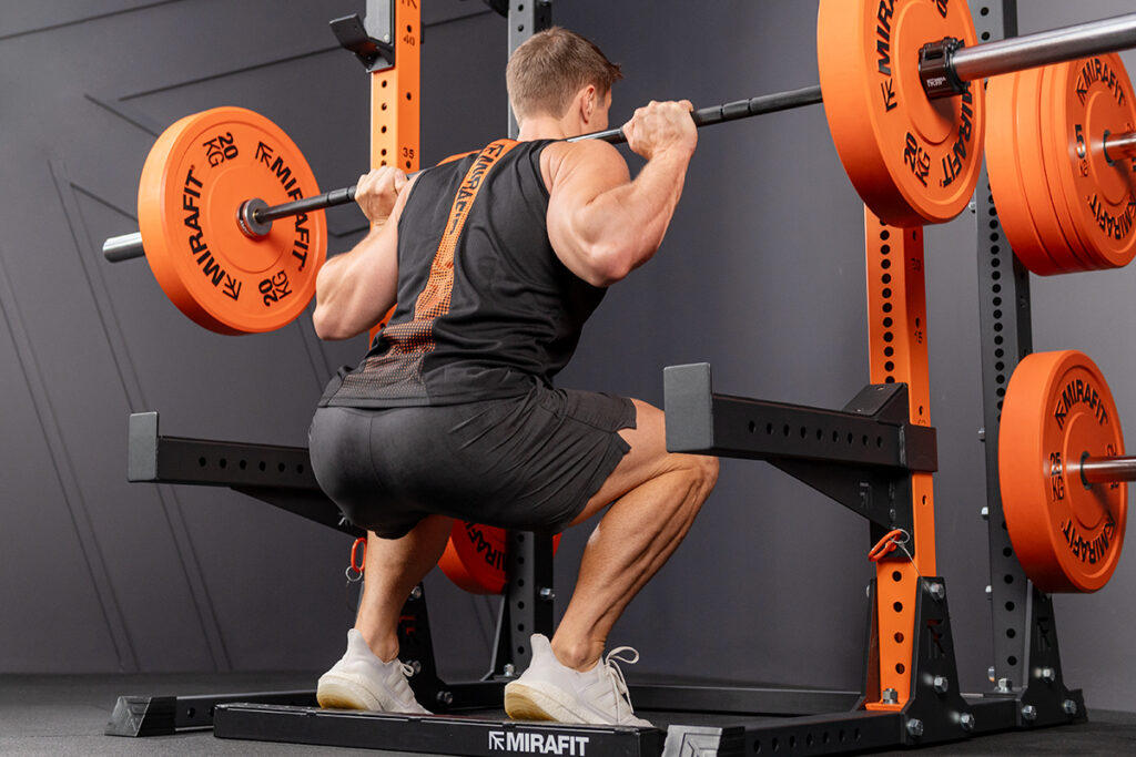 Squatting with Mirafit Olympic Bumper Plates
