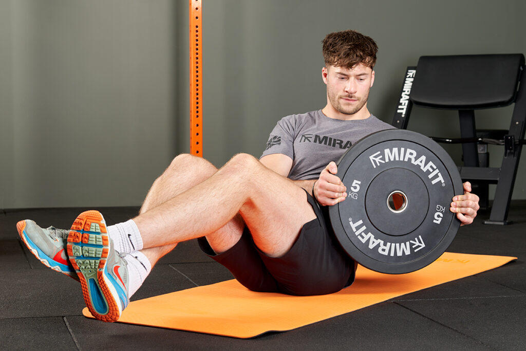 Mirafit Black Olympic Rubber Bumper Plates Russian Twist with Mirafit Bumper Plate
