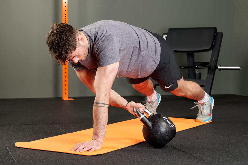 Mirafit Urethane Competition Kettlebell Plank drag with Mirafit Urethane Competition Kettlebell