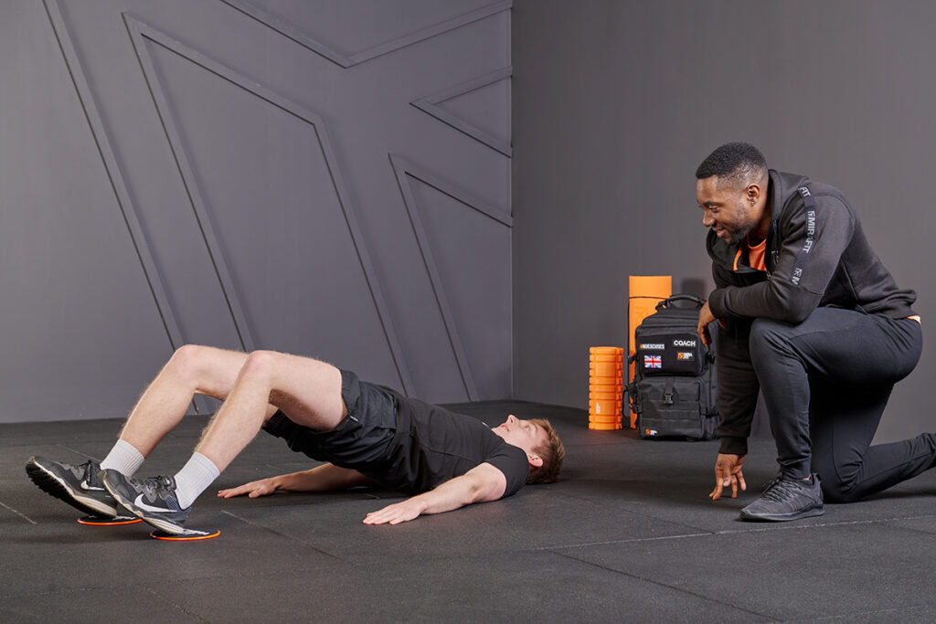 Hamstring bridge Sliders with Mirafit Core Sliders
