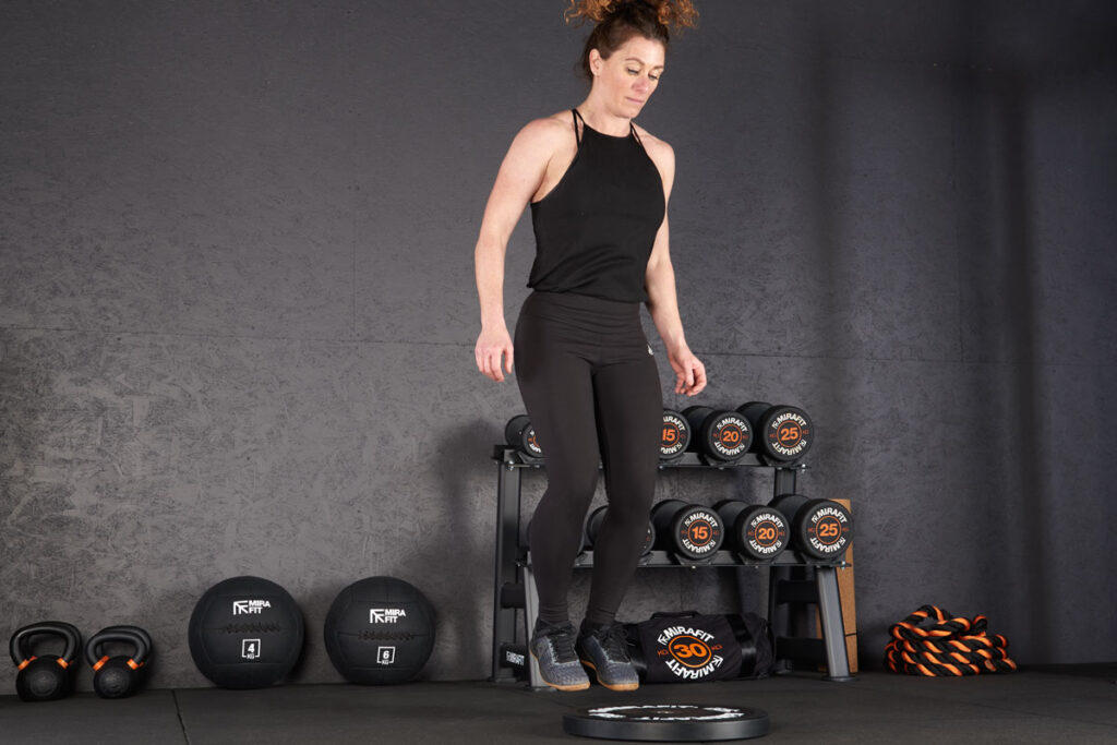 Plate Hop on a Mirafit Olympic Rubber Bumper Plate