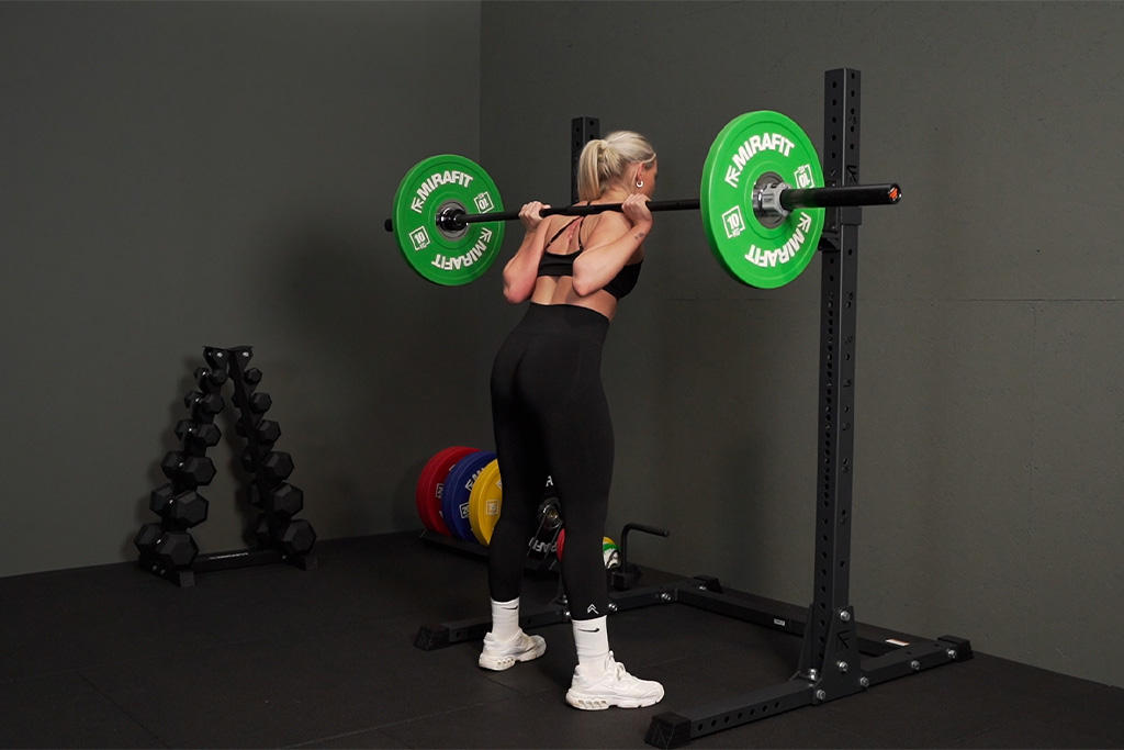 Mirafit Urethane Bumper Plates Squatting in a Mirafit Squat Rack