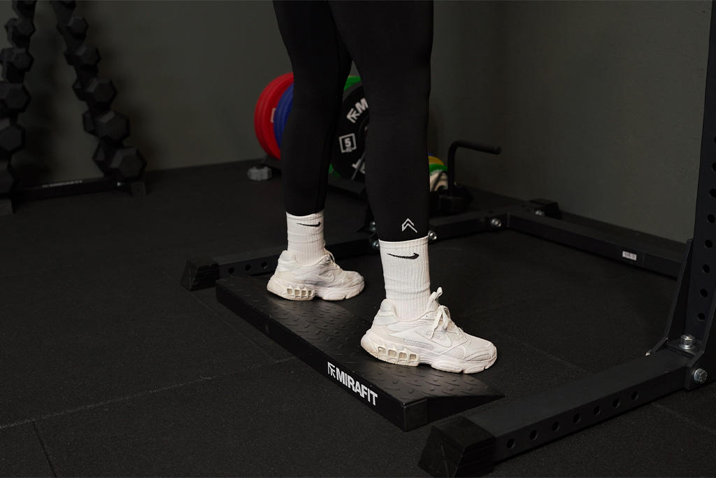 Mirafit Squat Ramp Platform Woman using Mirafit Squat Ramp Platform