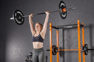 Shoulder press using Mirafit Black Olympic Rubber Bumper Plates
