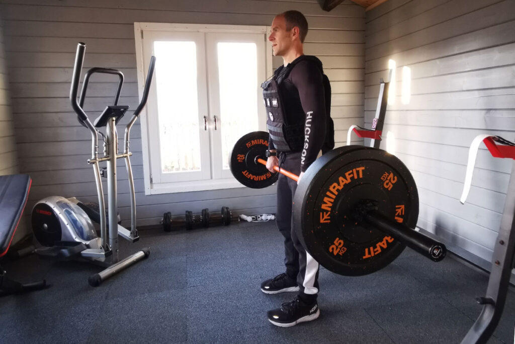 Man exercising in a Mirafit home gym
