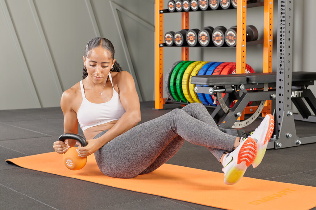 Mirafit Soft Touch Cast Iron Kettlebell Russian Twist using a Mirafit Kettlebell