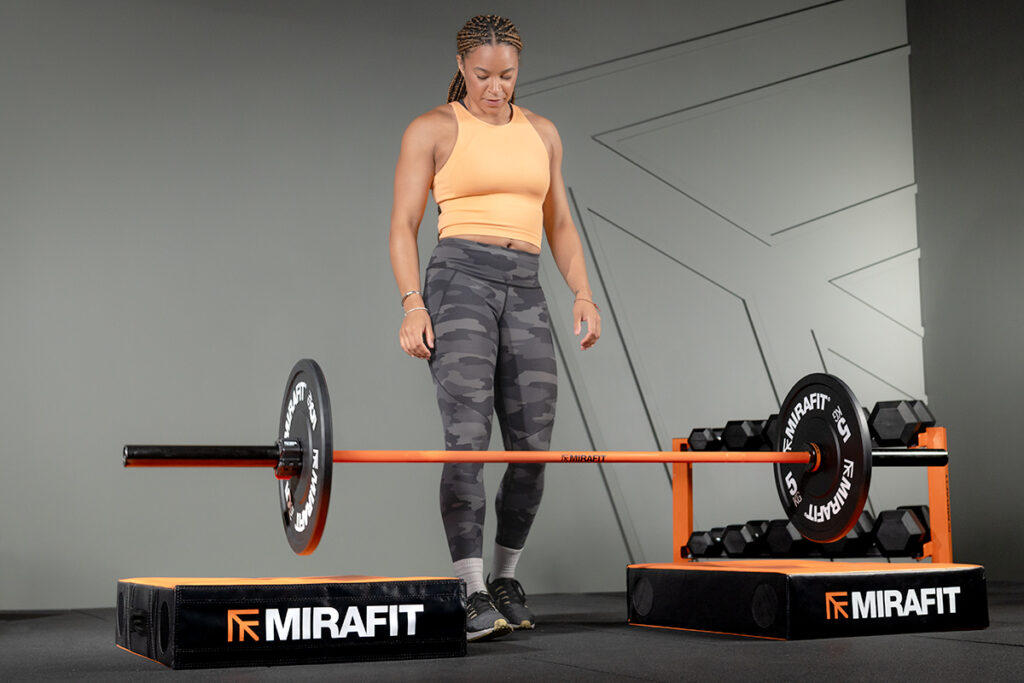 Mirafit M3 7ft 20kg Olympic Barbell Mica Moore dropping barbell onto Mirafit Weightlifting Drop Pads
