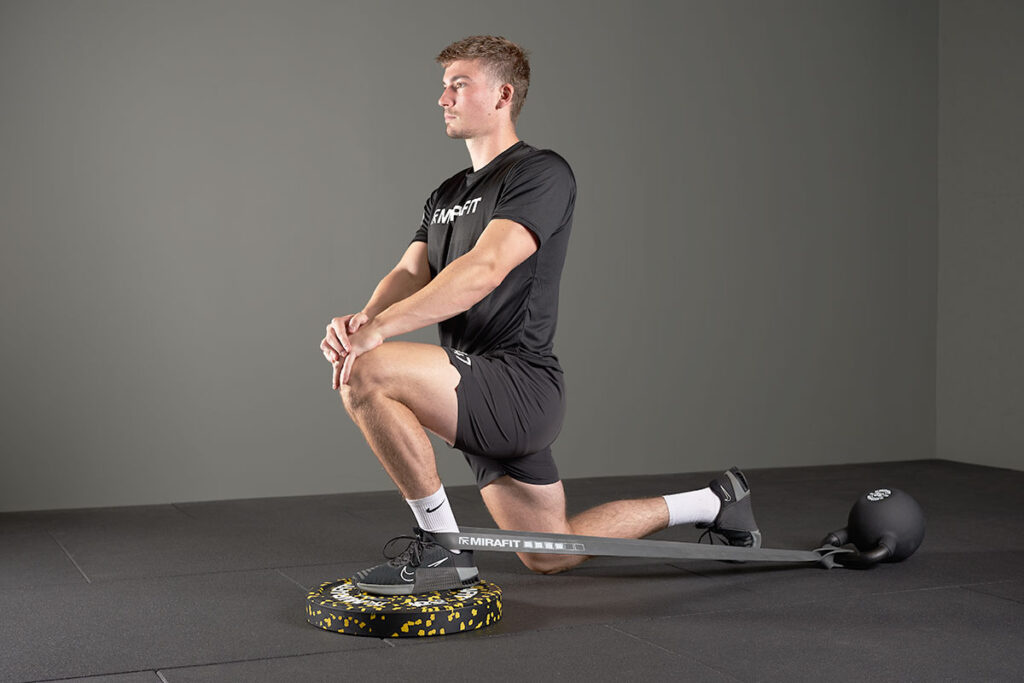 Banded lunge with a Mirafit Black Competition Kettlebell
