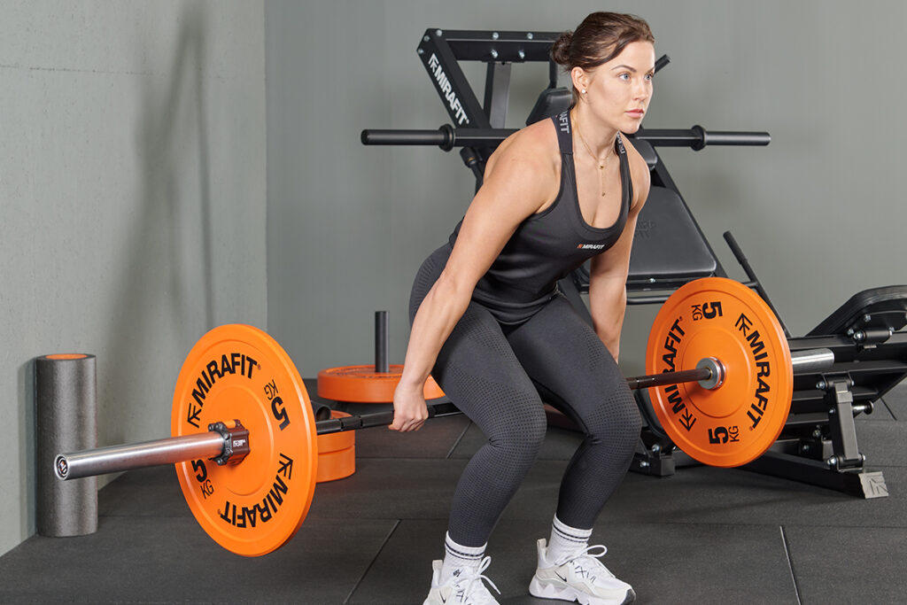 Mirafit M3 7ft 20kg Barbell Barbell hack squat using a Mirafit M3 Barbell