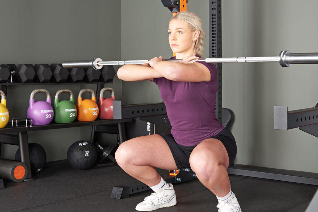 Mirafit M3 7ft 20kg Olympic Barbell Front squat using a Mirafit M3 7ft 20kg Barbell