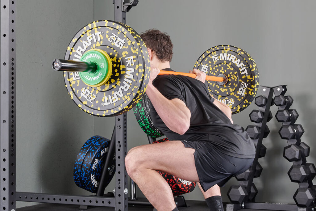 Man Squatting using Mirafit Fractional Change Plates