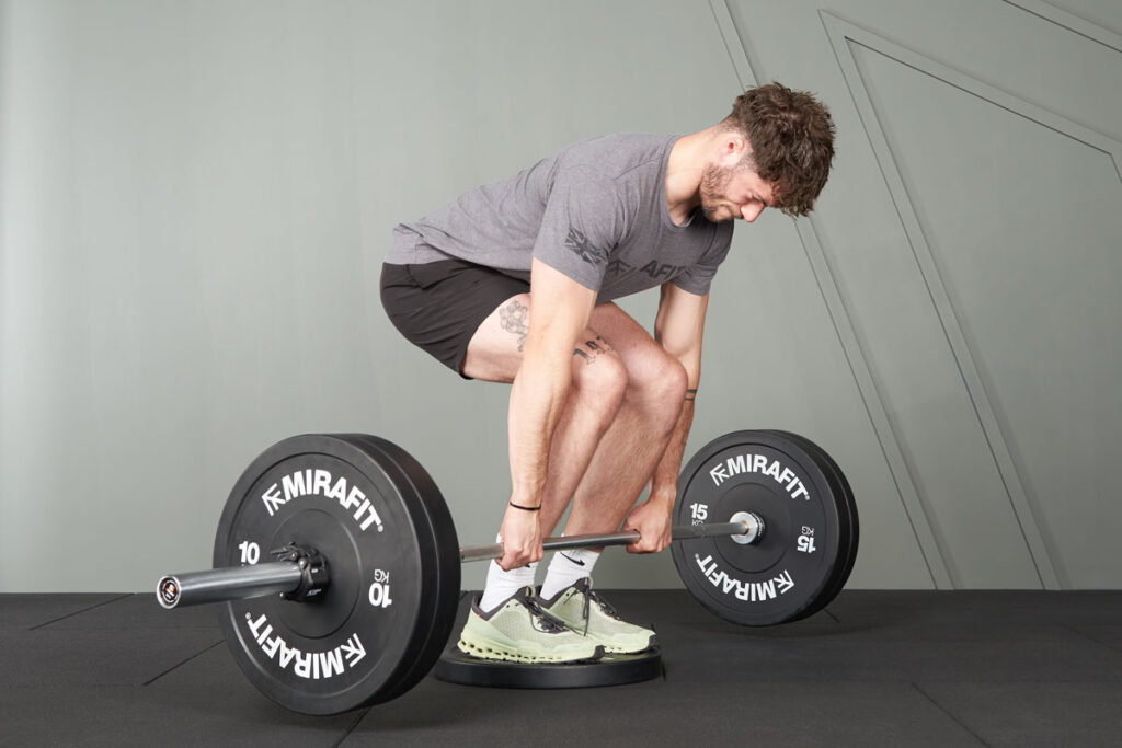 Mirafit M3 7ft 20kg Olympic Barbell deficit deadlift using Mirafit M3 7ft 20kg Olympic Barbell