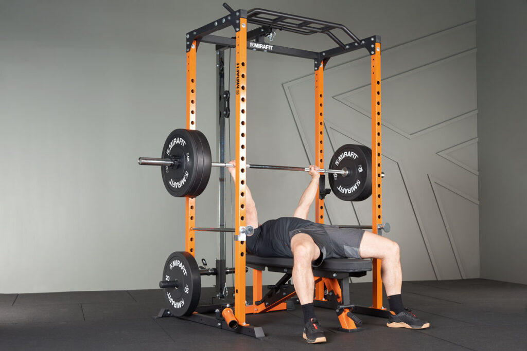 Mirafit Black Olympic Rubber Bumper Plates Bench Press in a Mirafit Power Rack