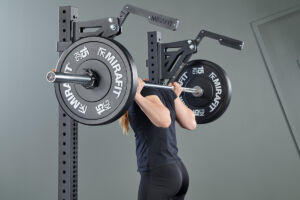 Athlete squatting with Mirafit M4 Monolift Attachment