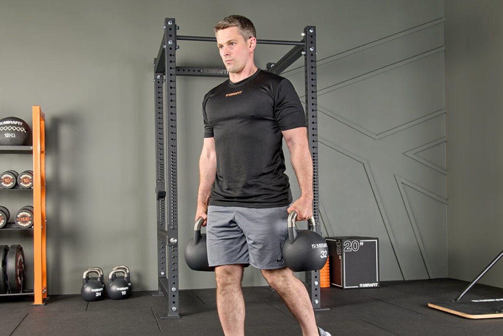 Farmers carries using Mirafit Black Competition Kettlebells