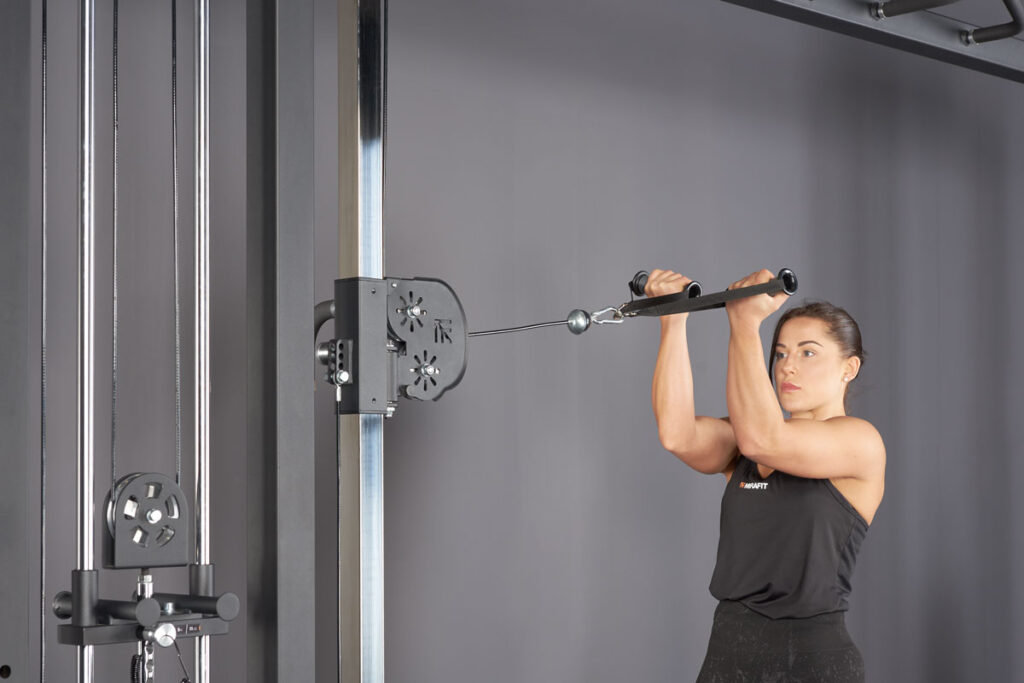 High cable curl using a Mirafit Cable Crossover Machine