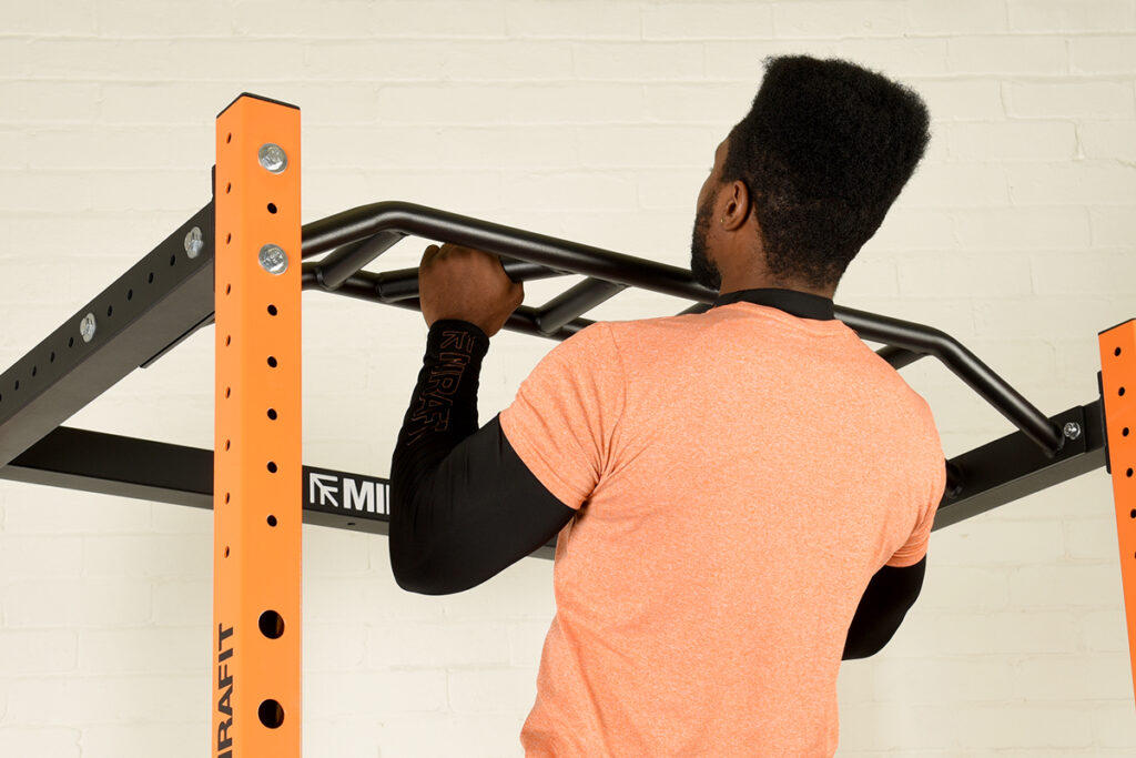 Mirafit Multi-Grip Pull Up Bar for M200 Series man performing pull ups on Mirafit Multi-Grip Pull Up Bar