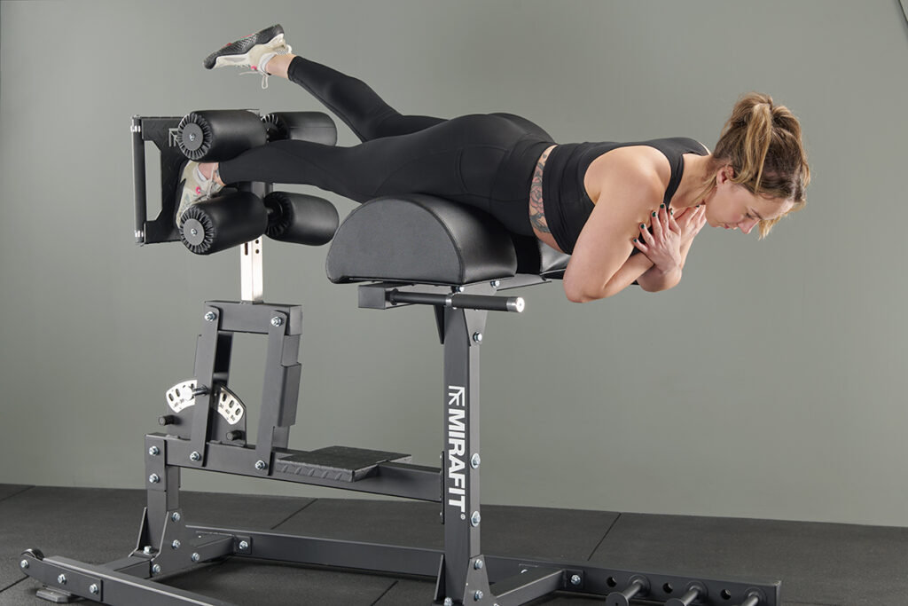 Single leg isometric hold on a Mirafit M4 GHD Machine
