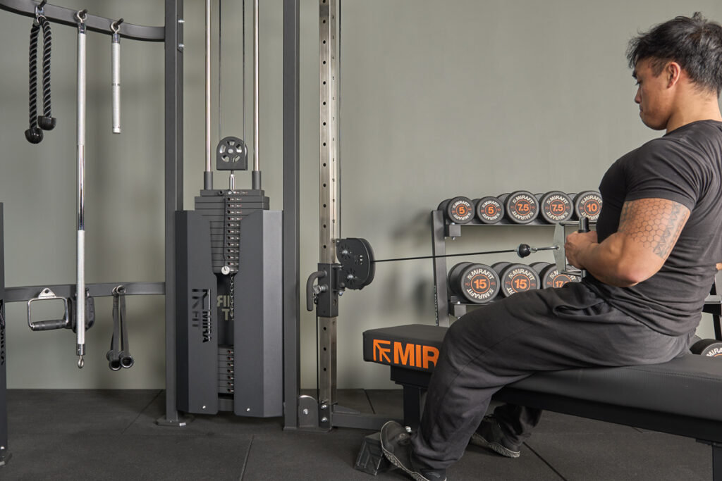 Seated row using Mirafit M4 Functional Trainer with Weight Stacks