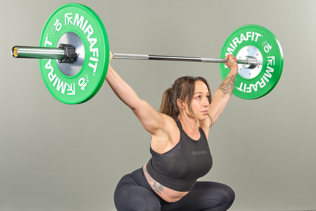 Mirafit Olympic Weightlifting Bumper Plates Sots press with Mirafit Olympic Weightlifting Bumper Plates