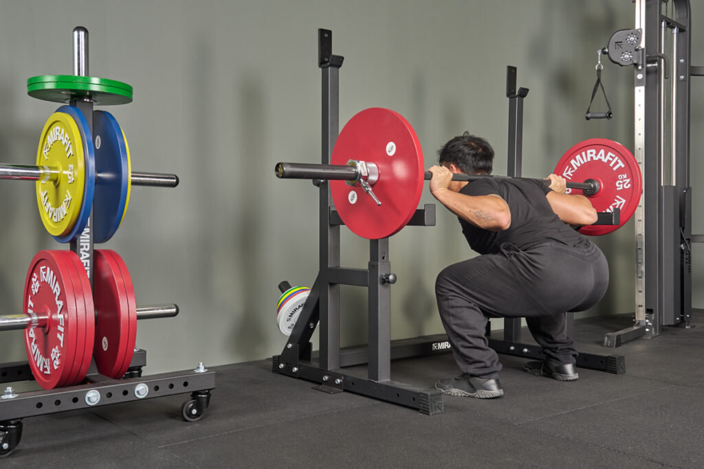 squat in a Mirafit M230 Squat and Bench Press Rack