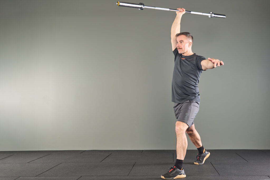 split stance javelin press with a Mirafit 15kg Barbell