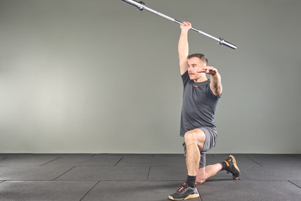 Mirafit Fine City Barbell Half kneeling javelin press with a Mirafit 15kg Barbell