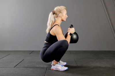 goblet squat with a Mirafit Black Competition Kettlebell